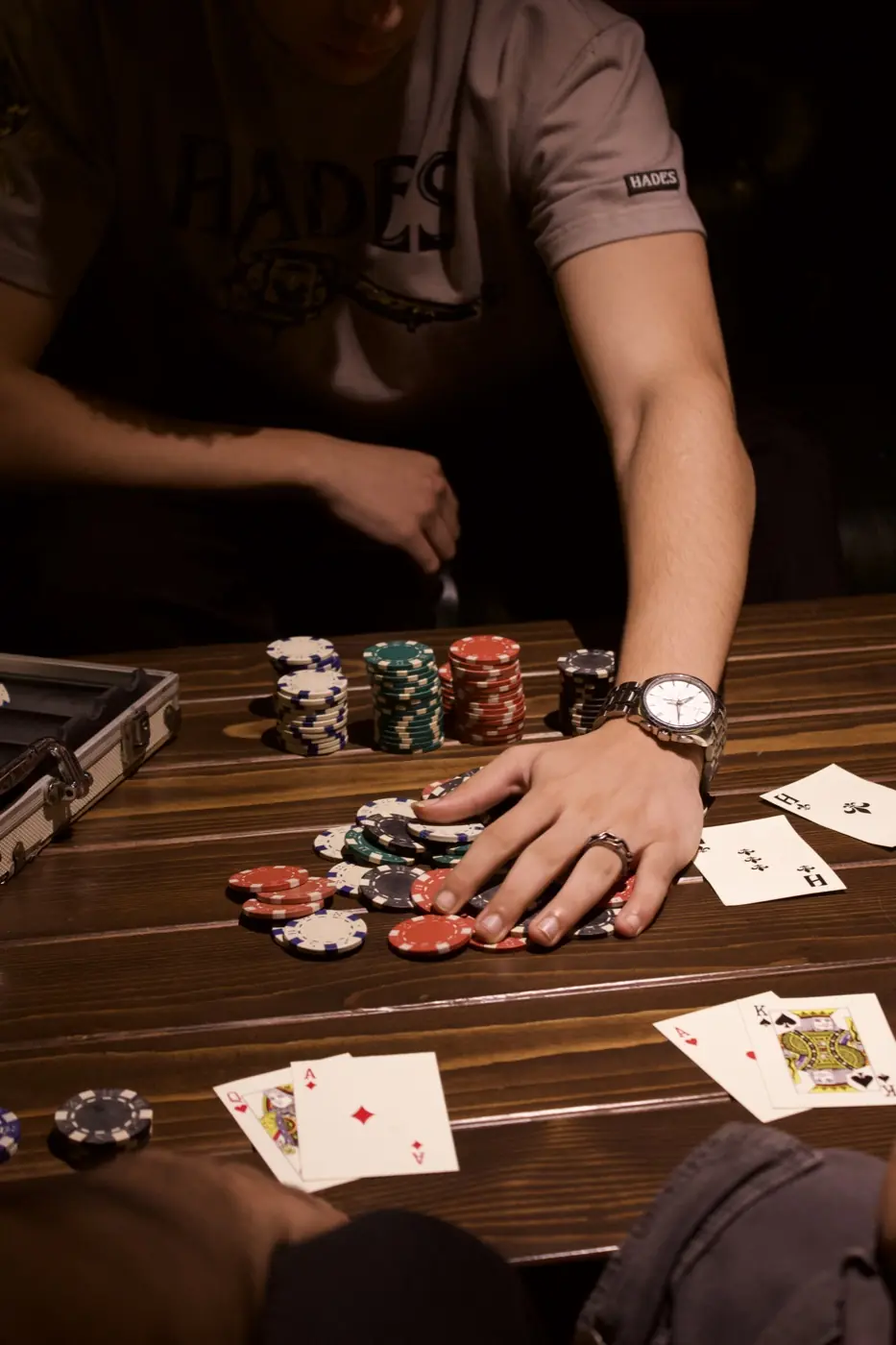 HADES lifestyle shoot at a poker table